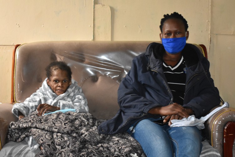 Photo of two women on a couch