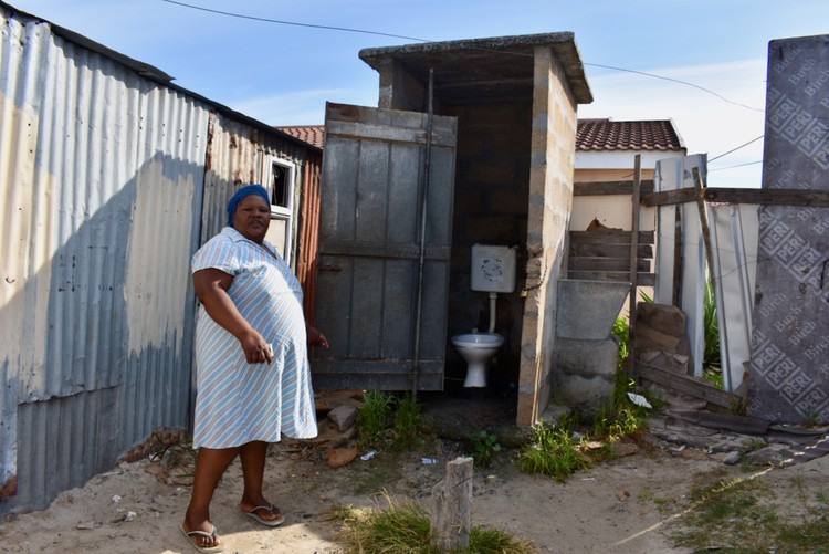 Photo of a woman and a toilet