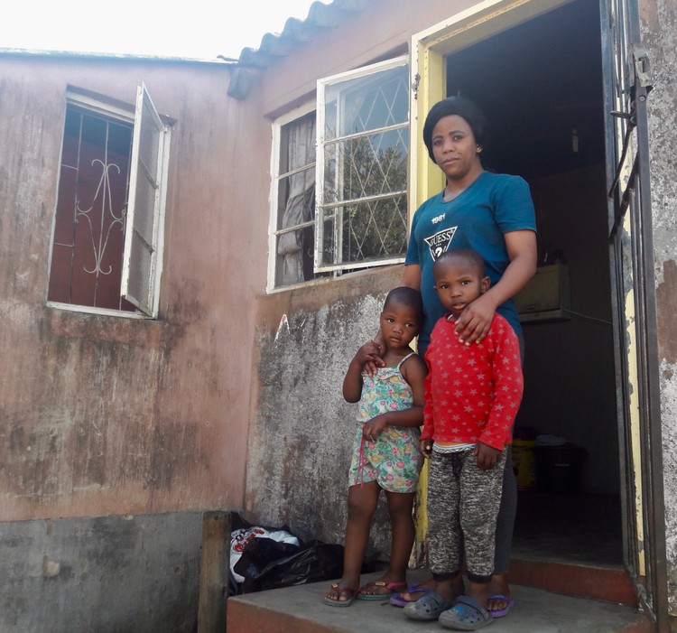 Photo of a woman and two children