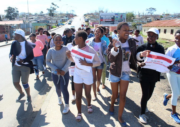 Photo of girls and women marching