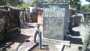 Photo of child filling up a water cannister