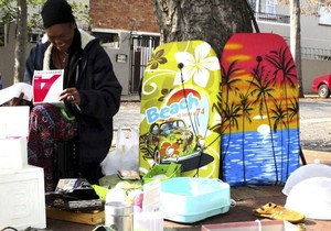 Photo of woman and her pop-up pavement shop