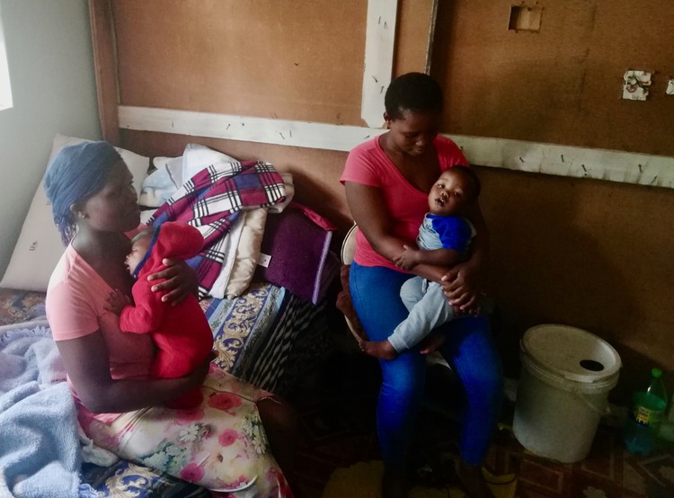 Photo of two women with children