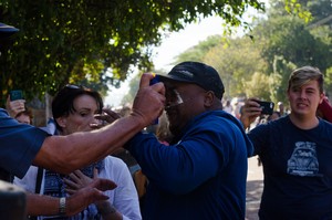 Photo of police in conflict with a protester