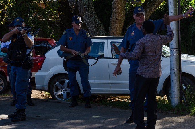 Photo of man talking to police