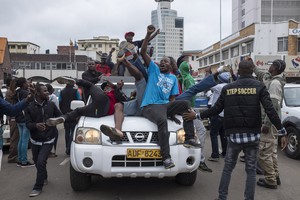 Thousands of Zimbabweansmarch for the removal of Robert Mugabe.