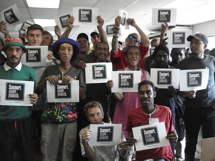 Photo of people with placards