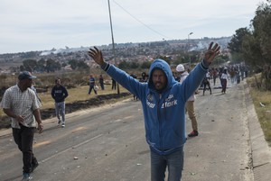 Photo of man with hands in air