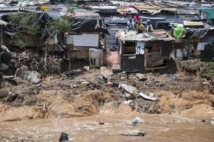 Photo of men sitting on a shack