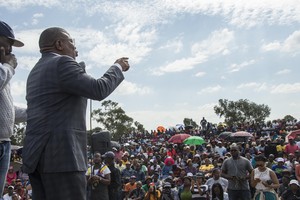 Photo of man addressing meeting