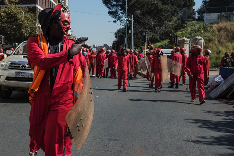 Photo of men in red uniforms