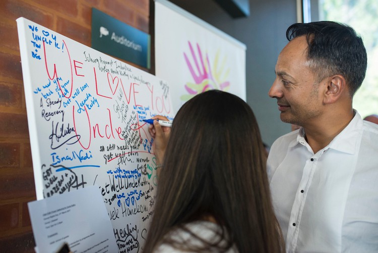 Photo of people writing on a whiteboard