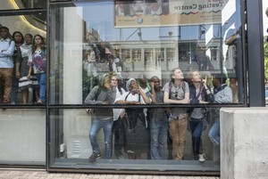 Photo of people watching protest battle