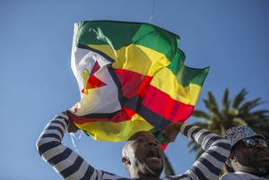 Photo of a man with a flag