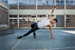 Photo of boy in ballet position.