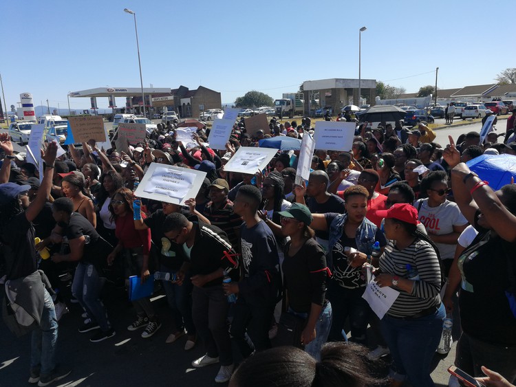 Photo of people marching in street