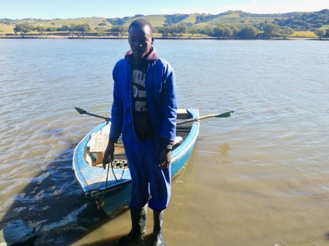 Photo of a man and a rowing boat