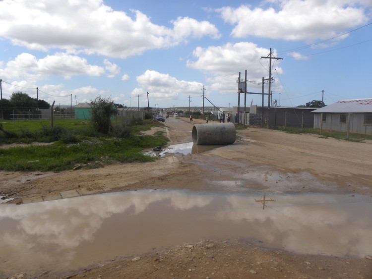 Photo of sewage leaking down street