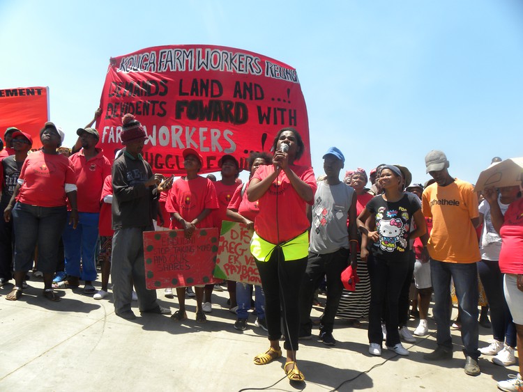 Photo of farm workers marching.