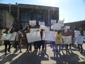 Photo of people with placards