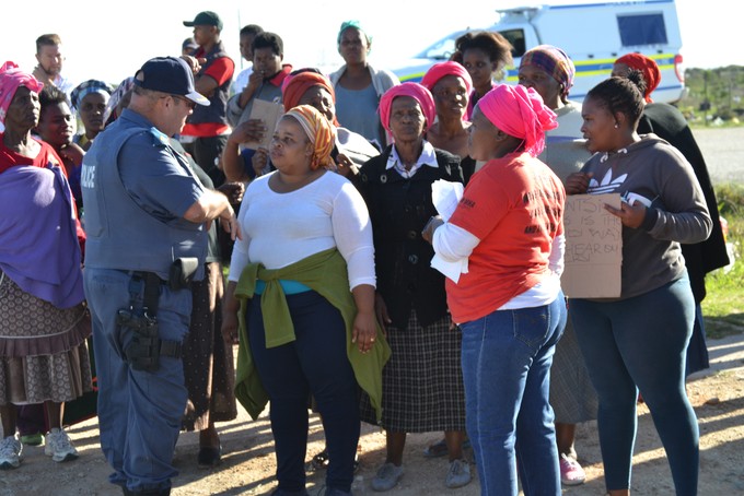 Photo of protesters talking to police