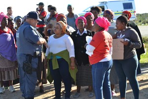 Photo of protesters talking to police