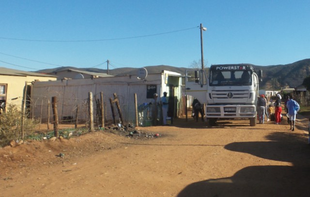 Photo of dirt road with a truck