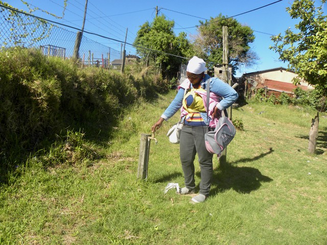 Photo of a woman and a tap