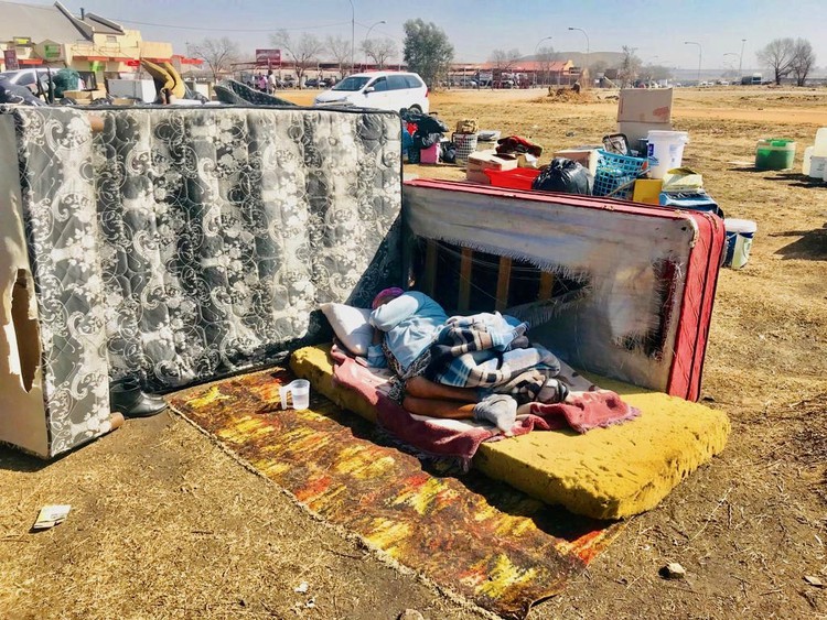 Photo of a woman on a mattress outside