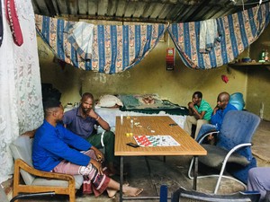 Photo of four men in a room