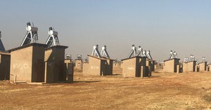 Photo of toilet structures with names on