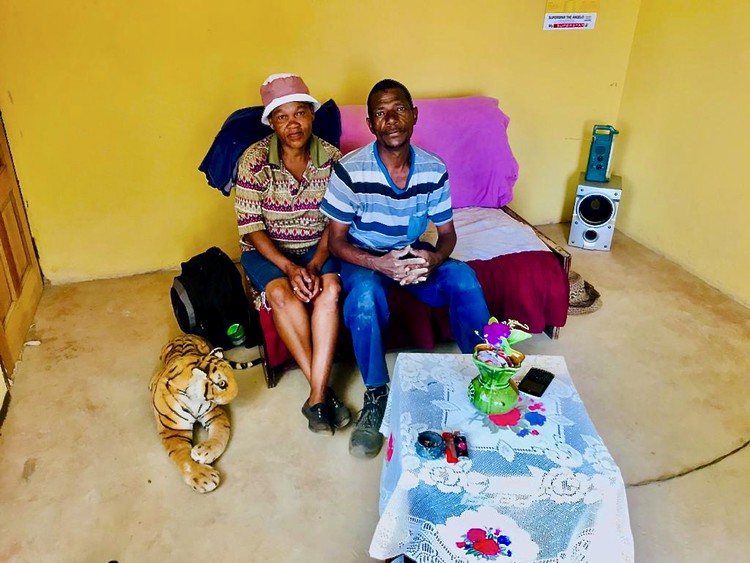 Photo of two people on a couch