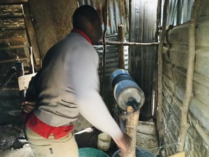 Photo of a miner processing gold