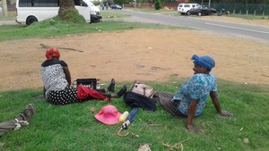 Photo of two women on the side of a road