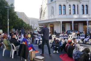 Photo of man addressing crowd