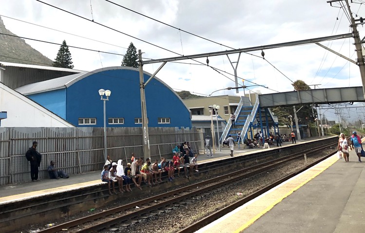 Photo of people waiting on platform