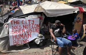 Photo of man sitting outside church