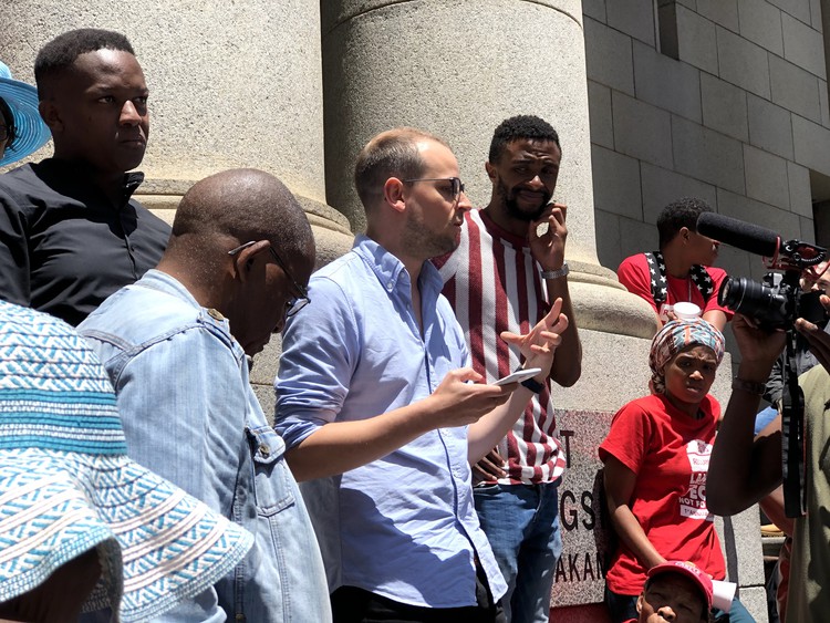 Photo of people outside court