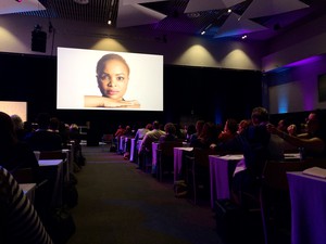 Photo of woman on screen