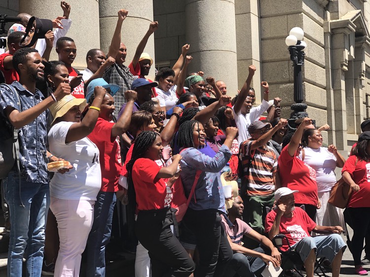 Photo of a crowd of people on the court steps