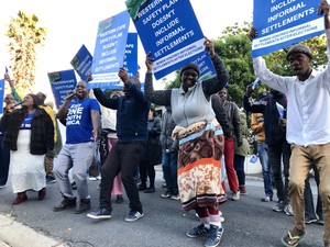 Photo of protesters with placards