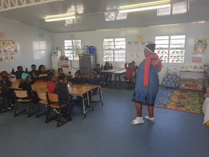 Photo of woman in classroom with toddlers