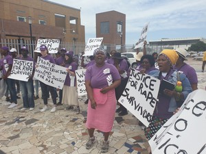 Photo of people protesting with placards