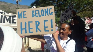 Photo of a woman with a placard