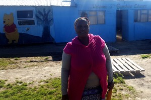 Photo of woman in front of creche