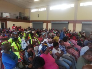 Photo of residents sitting in a hall