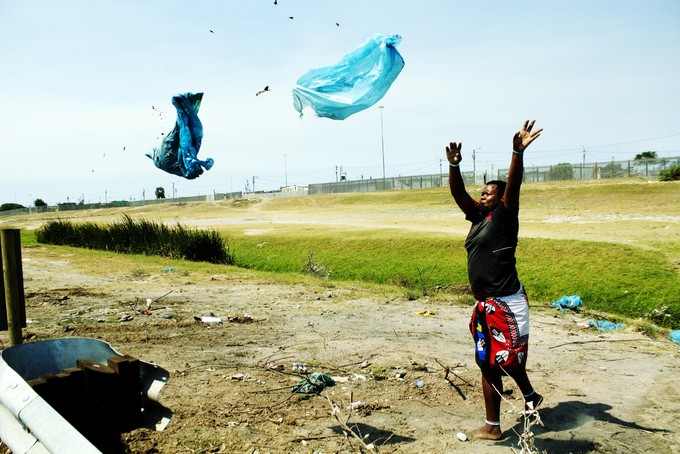 Photo of man throwing faeces.