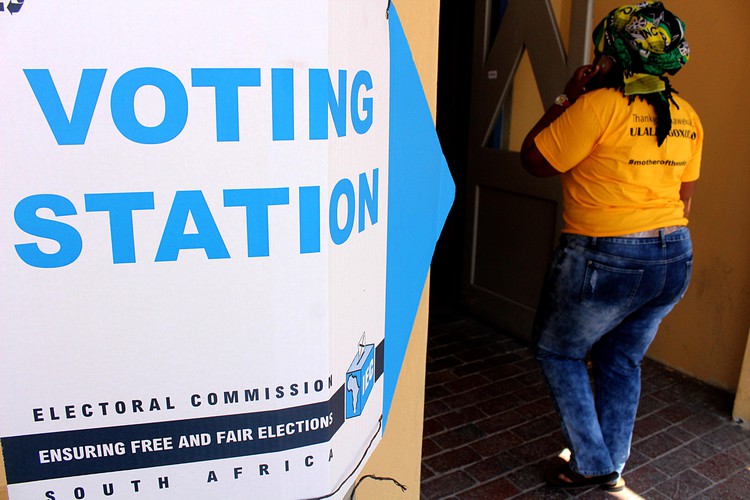 Photo of a person entering a voting station