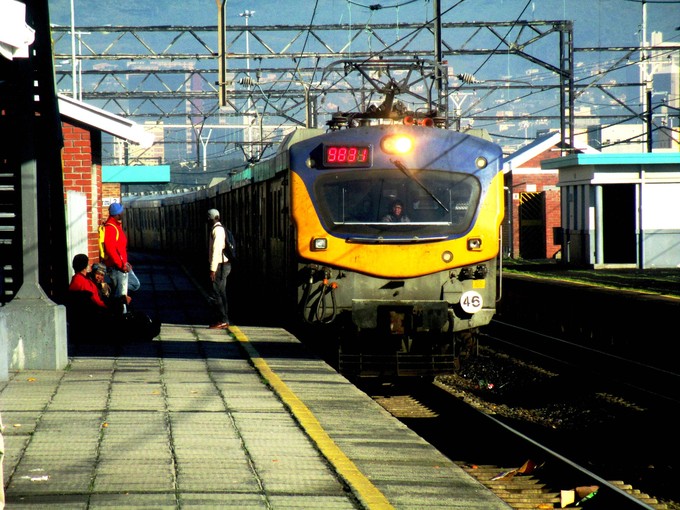 Photo of people hanging off trains