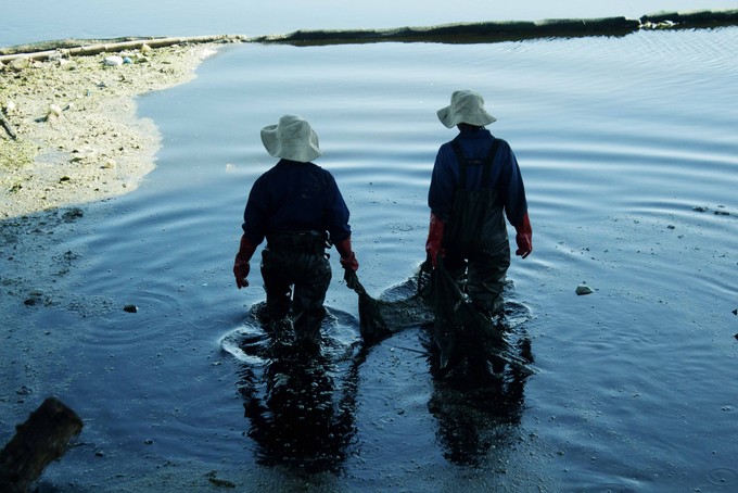 Photo of women cleaning a river